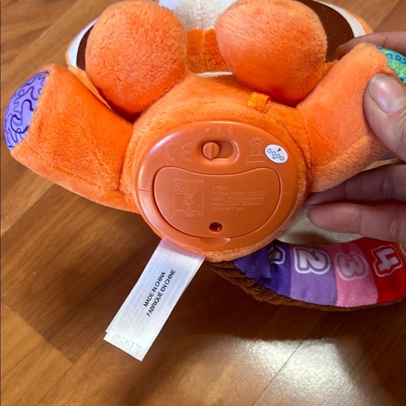 Orange and Blue Stuffed Raccoon Toy with Cartoonish Design - Picture 4 of 8